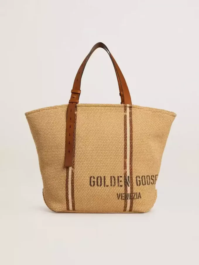 24,7 tote bag van natuurlijk raffia en bruin leer met goudkleurige metalen details