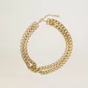 Antiek goudkleurige gevlochten ketting met stervormige sluiting.