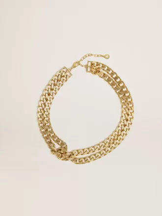 Antiek goudkleurige gevlochten ketting met stervormige sluiting.