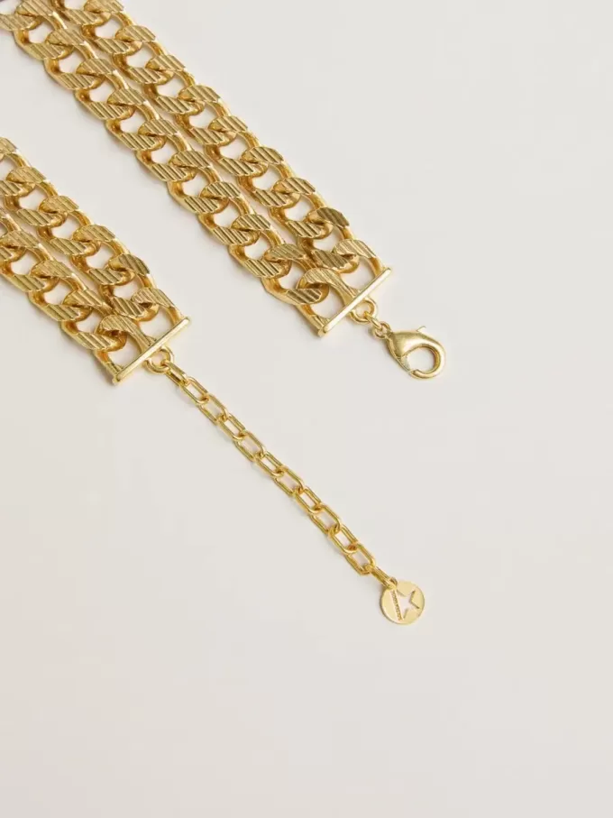 Antiek goudkleurige gevlochten ketting met stervormige sluiting.