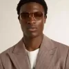 Aviator-zonnebril met gouden montuur en beige glazen