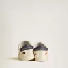 Baby School in nappaleer met muzikale print en witte suède ster