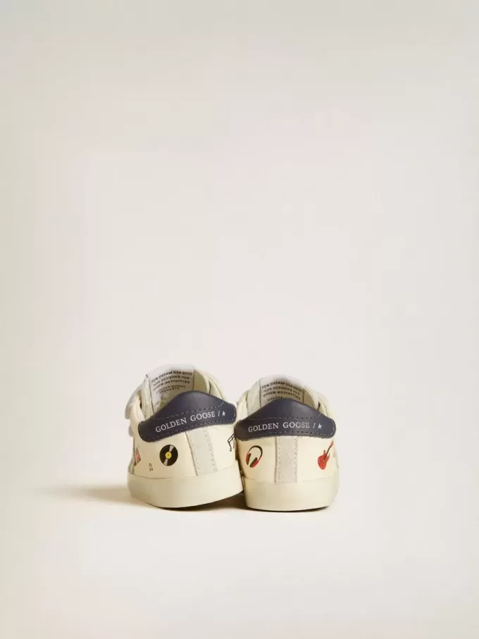 Baby School in nappaleer met muzikale print en witte suède ster