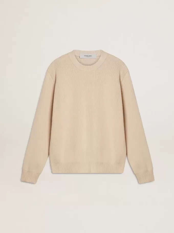 Beige damestrui met ‘Golden’-opschrift op de achterkant