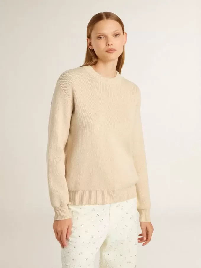 Beige damestrui met ‘Golden’-opschrift op de achterkant