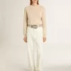 Beige damestrui met ‘Golden’-opschrift op de achterkant