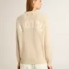 Beige damestrui met ‘Golden’-opschrift op de achterkant