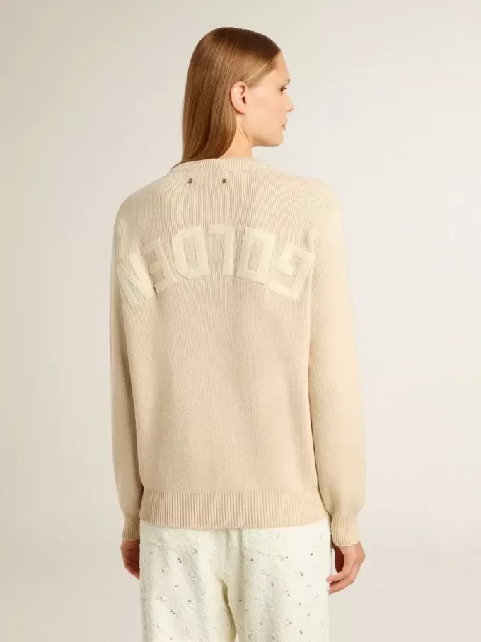 Beige damestrui met ‘Golden’-opschrift op de achterkant