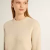 Beige damestrui met ‘Golden’-opschrift op de achterkant
