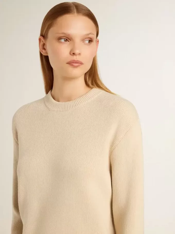 Beige damestrui met ‘Golden’-opschrift op de achterkant