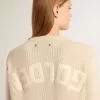 Beige damestrui met ‘Golden’-opschrift op de achterkant