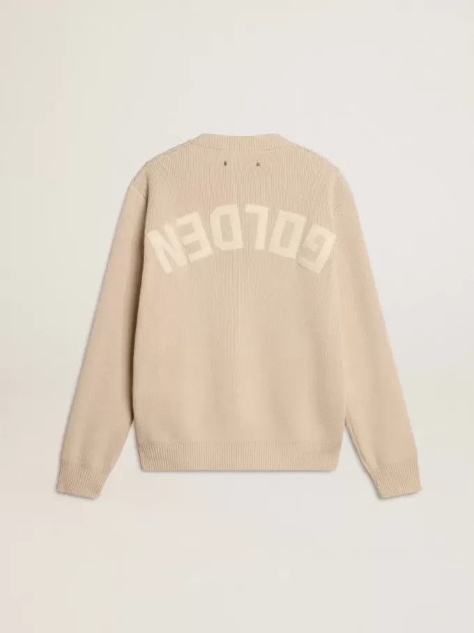 Beige damestrui met ‘Golden’-opschrift op de achterkant