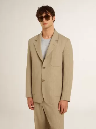 Beige herenjas met krijtstreep en enkele rij knopen, oversized pasvorm