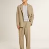 Beige herenjas met krijtstreep en enkele rij knopen, oversized pasvorm