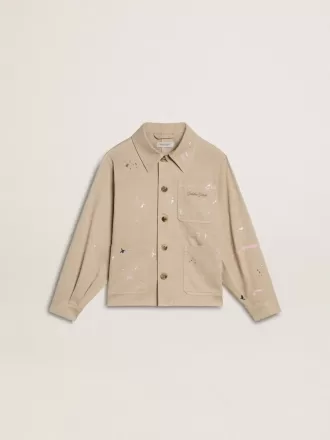 Beige kinderjasje met veelkleurige spatten