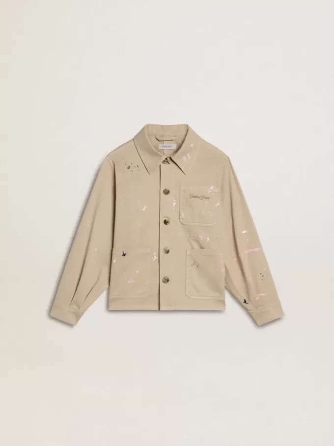 Beige kinderjasje met veelkleurige spatten