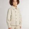 Beige kinderjasje met veelkleurige spatten