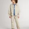 Beige kinderjasje met veelkleurige spatten