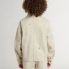 Beige kinderjasje met veelkleurige spatten