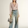 Beige wollen trui met lederen details