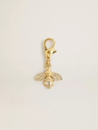 Bijvormige bedel van goudkleurig messing met kristallen