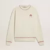 CNY-sweatshirt van versleten wit katoen met rode borduursels