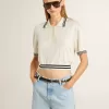 Dames polo shirt in cropped model van versleten wit katoen met blauwe ribboorden