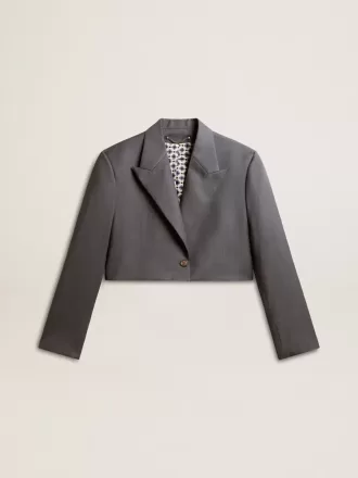 Damesjasje met enkele rij knopen in babyblauwe wol