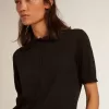 Damespoloshirt van zwarte merinowol