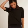 Damespoloshirt van zwarte merinowol