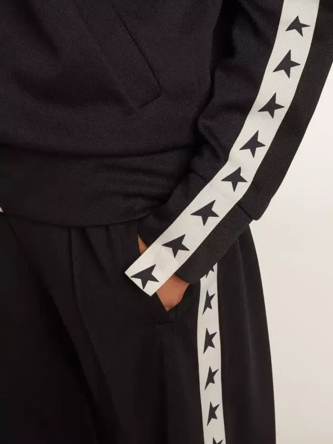 Donkerblauw sweatshirt met ritssluiting, witte streep en contrasterende sterren