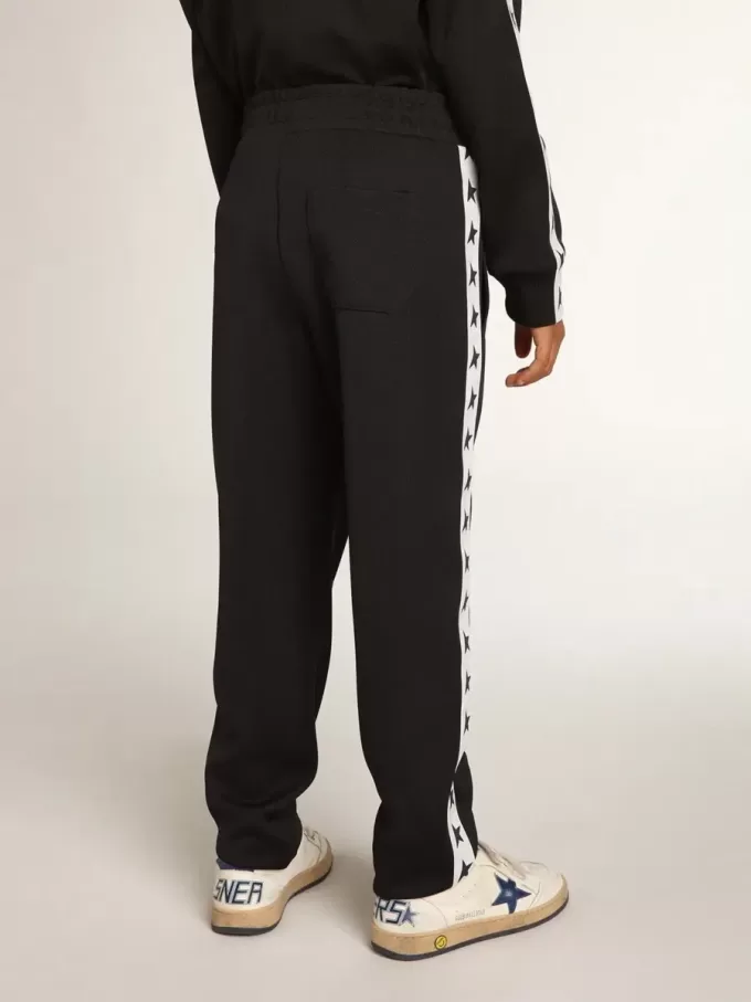 Donkerblauwe joggingbroek met witte streep en contrasterende sterren
