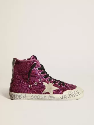 Francy sneakers met pailletten en handgeschreven letters op de buitenzool