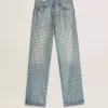 Gewassen damesjeans met oogjes over het hele oppervlak