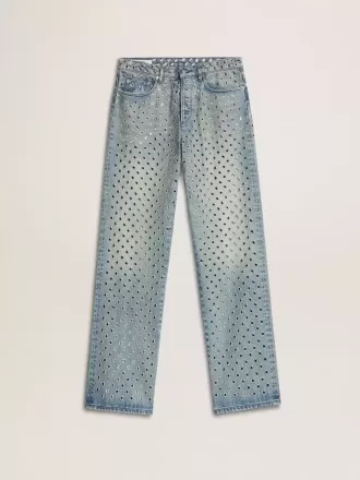 Gewassen damesjeans met oogjes over het hele oppervlak