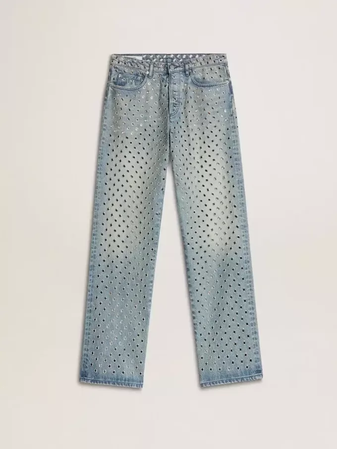 Gewassen damesjeans met oogjes over het hele oppervlak