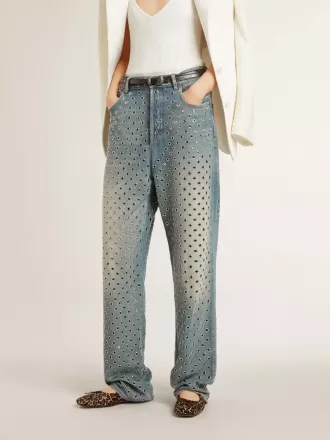 Gewassen damesjeans met oogjes over het hele oppervlak