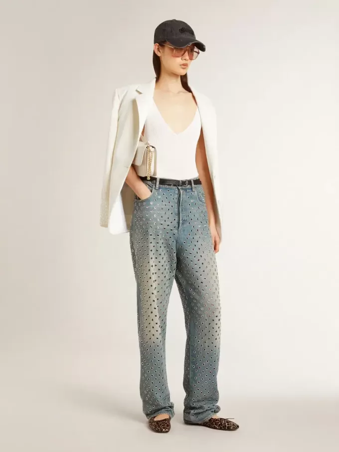 Gewassen damesjeans met oogjes over het hele oppervlak