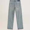 Gewassen damesjeans met oogjes over het hele oppervlak