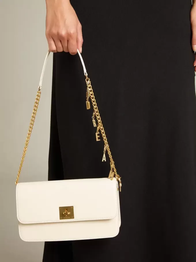 Gioia-tas in botergeel leer met gouden details