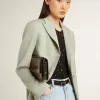 Gioia-tas in glanzend zwart leer met metalen details