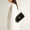 Gioia-tas in zwart leer met gouden details