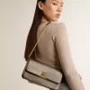 Gioia-tas in zwart vintage leer met gouden details