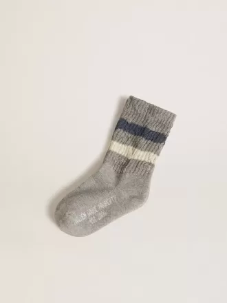 Grijze kindersokken met distressed details en versleten witte en blauwe strepen