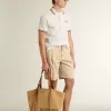 Herenpoloshirt in wit geperforeerd breisel met bordeauxrode gestreepte details