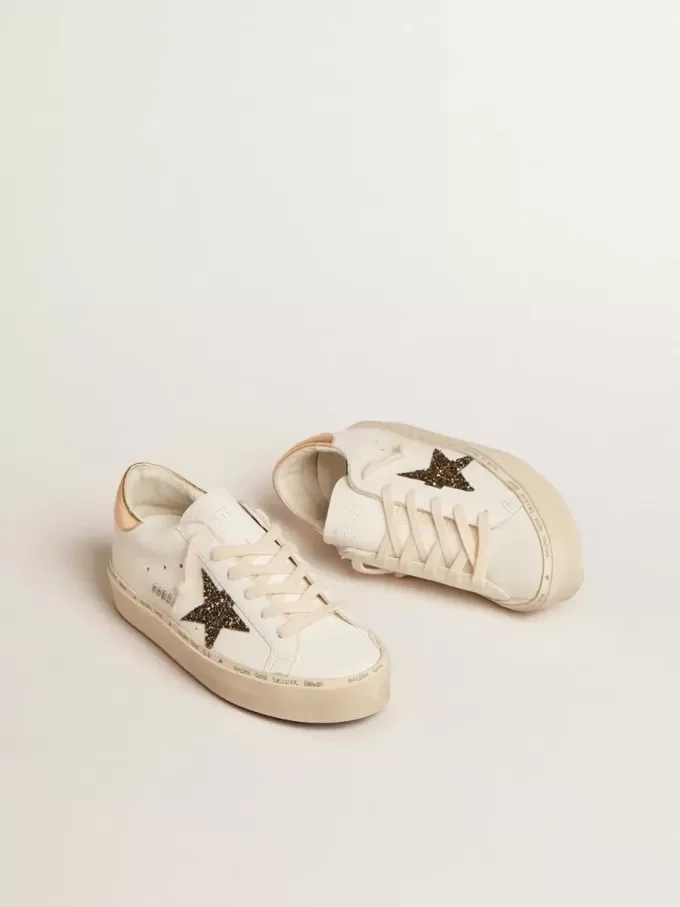 Hi Star LTD met zwarte en gouden glitterster en gouden hiellip