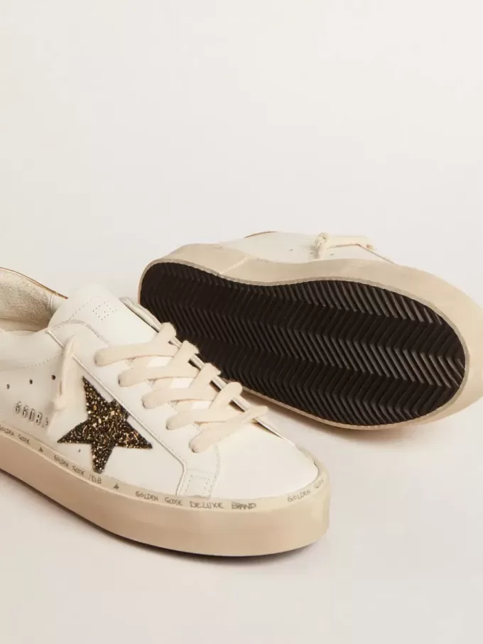 Hi Star LTD met zwarte en gouden glitterster en gouden hiellip