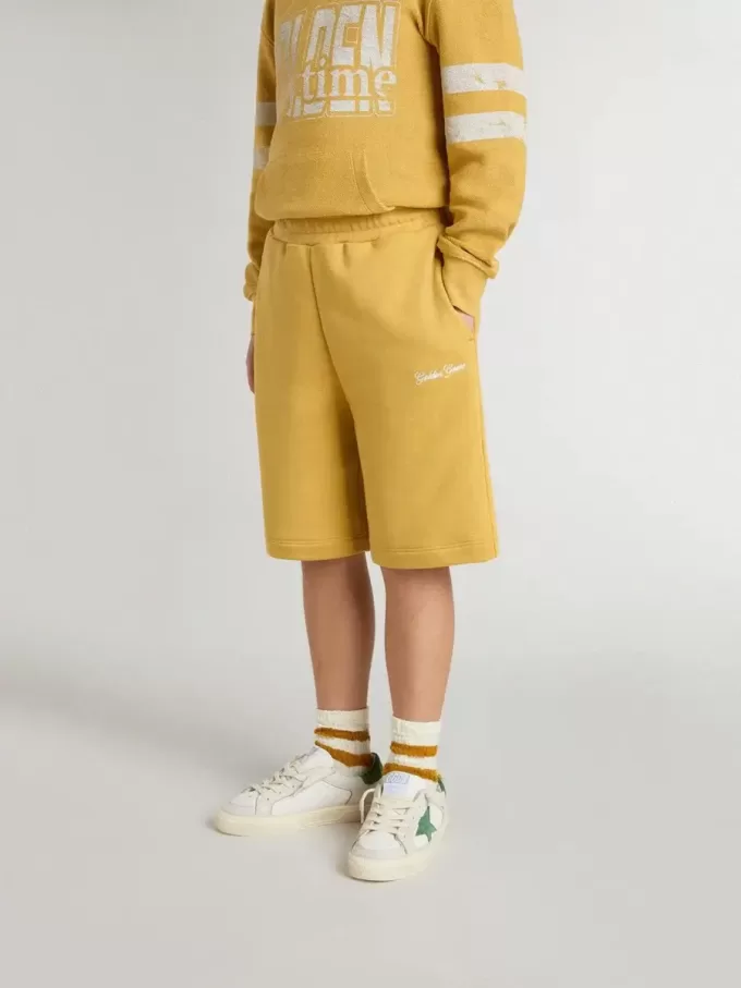 Kinderjoggingbroek in okergeel met borduursel