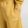 Kinderjoggingbroek in okergeel met borduursel
