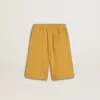Kinderjoggingbroek in okergeel met borduursel